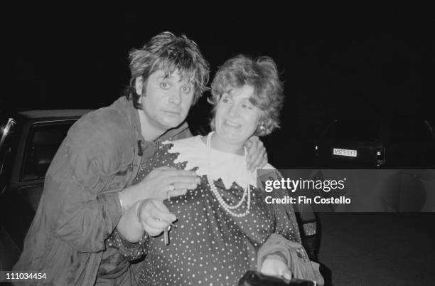 Ozzy Osbourne poses with his wife Sharon Osbourne at Ridge Farm Studios in West Sussex during the recording of 'Bark At The Moon' album in August...