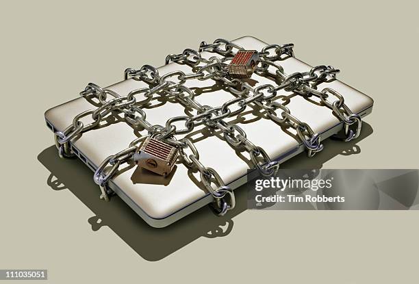 laptop with chains and padlocks. - laptop ban stock pictures, royalty-free photos & images