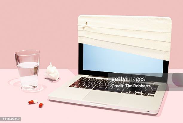 sick laptop with bandage and pills. - damaged laptop stock pictures, royalty-free photos & images