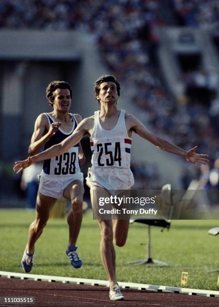 Sebastian Coe of Great Britain raises his arms in celebration as he crosses the finish line ahead of Jurgen Straub to win the men's 1500m race on 1st...