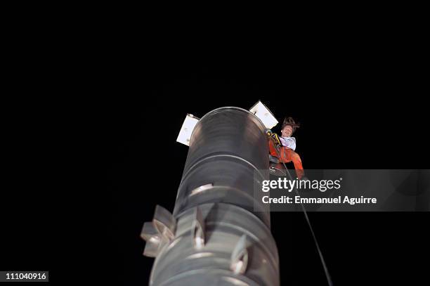 Alain Robert, known as the French "Spiderman" poses after climbing to the top of the highest building in the world, Burj Khalifa on March 28, 2011 in...