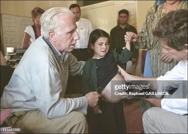 Dr - Cheysson examining a child at Dr - Nilab's medical office - This child is one of those who will be sent to the Paris Pompidou Hospital for a...