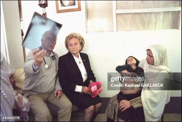 From left to right : Pr - Deloche showing X-Rays of this child, who will be sent to the Georges Pompidou Hospital in Paris for a better medical...