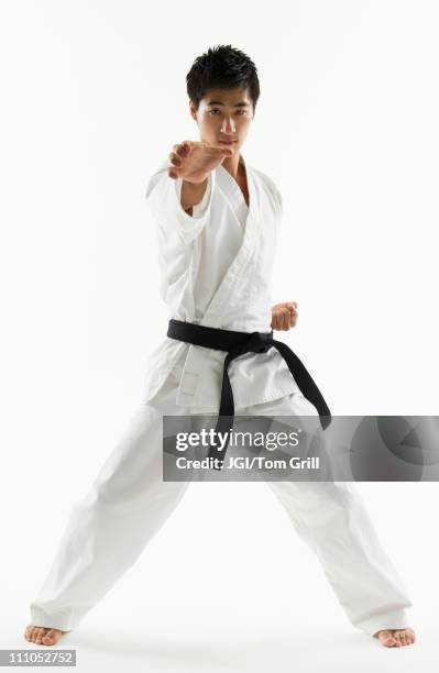 asian male black belt practicing karate - karate imagens e fotografias de stock