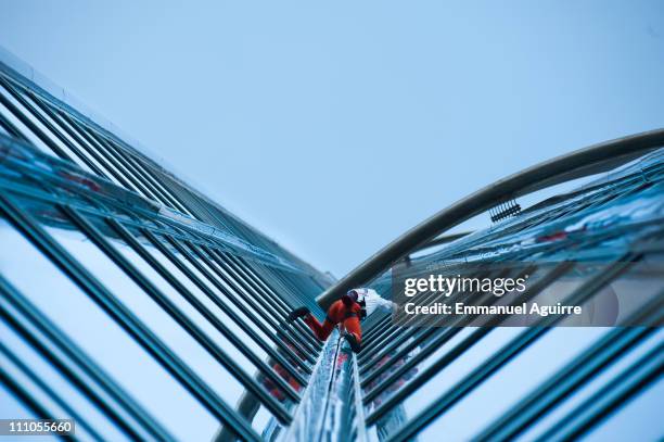 Alain Robert, known as the French "Spiderman" climbs the highest building in the world, Burj Khalifa on March 28, 2011 in Dubai, United Arab...