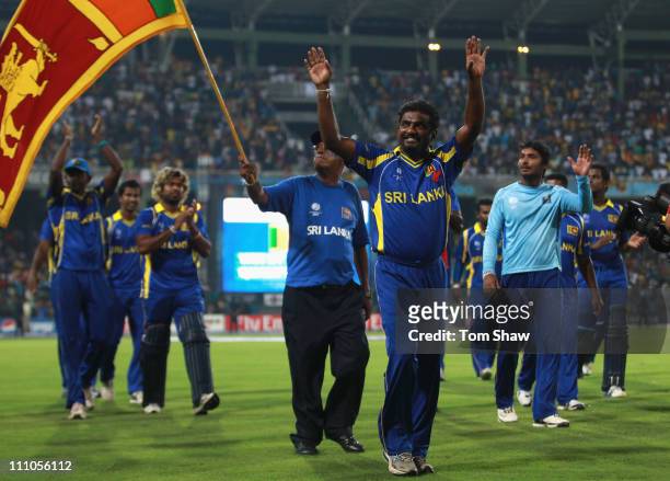 Muttiah Muralitharan of Sri Lanka acknowledges the crowd after playing his last match in Sri Lanka during the 2011 ICC World Cup Semi-Final match...