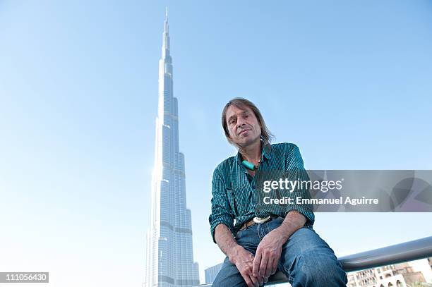 Alain Robert, known as the French "Spiderman" poses while making a climbing reconnaissance of the highest building in the world, Burj Khalifa on...