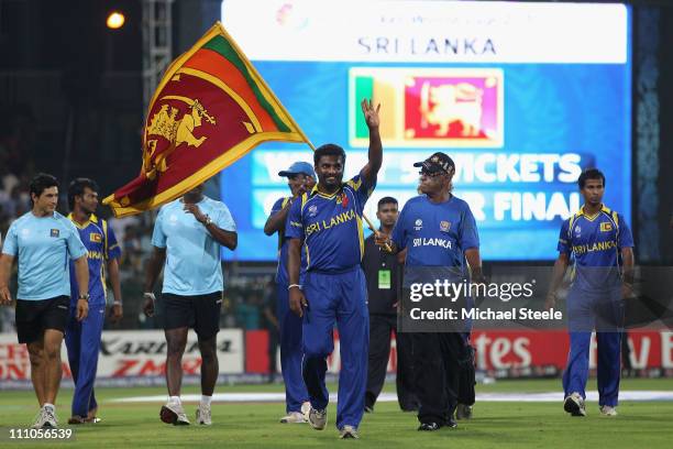 Muttiah Muralitharan of Sri Lanka waves to the crowd after his last match on home soil and his sides five wicket victory during the 2011 ICC World...