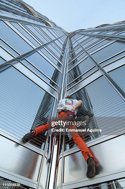 Alain Robert, known as the French "Spiderman" climbs the highest building in the world, Burj Khalifa on March 28, 2011 in Dubai, United Arab...