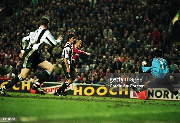 Stan Collymore of Liverpool scores a dramatic last minute winning goal during the FA Carling Premiership match between Liverpool and Newcastle United...