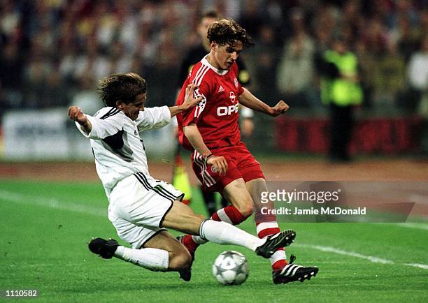 Owen Hargreaves of Bayern Munich is tackled by Michel Salgado of Real Madrid during the UEFA Champions League Semi Final second -leg between Bayern...