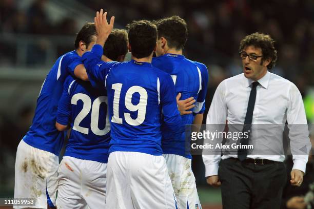 Christian Maggio of Italy celebrates his team's second goal with team mates and head coach Ciro Ferrara during the U21 international friendly match...