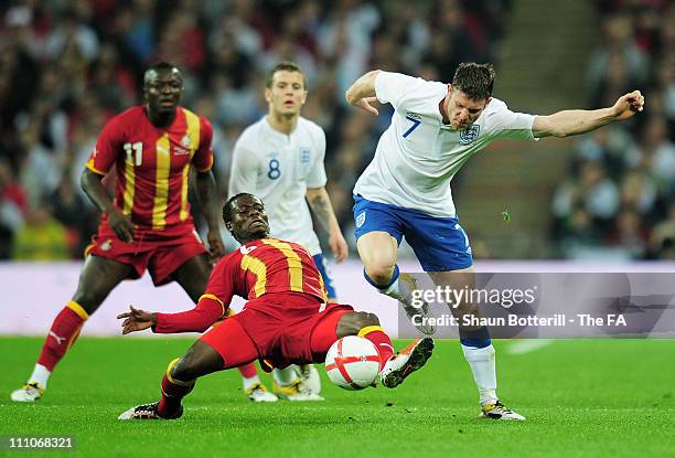 Anthony Annan of Ghana vies with James Milner of England during the international friendly match between England and Ghana at Wembley Stadium on...