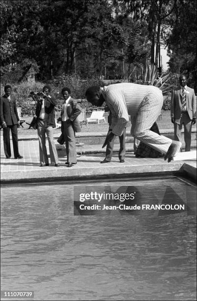 Ugandan president Idi Amin Dada diving in the swimming pool in the summit of Uganda in Addis Ababa, Ethiopia on January 10, 1976.