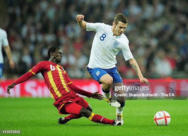 Anthony Annan of Ghana tackles Jack Wilshere of England during the international friendly match between England and Ghana at Wembley Stadium on March...
