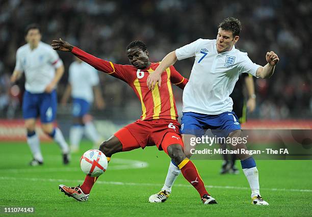 Anthony Annan of Ghana and James Milner of England compete for the ball during the international friendly match between England and Ghana at Wembley...