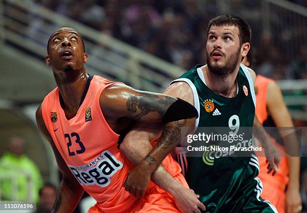 Terence Morris, #23 of Regal FC Barcelona competes with Antonis Fotsis, #9 of Panathinaikos Athens during the Play-Offs Date 3 game between...