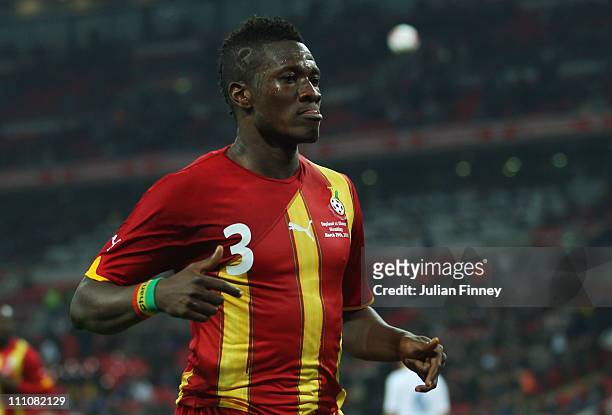 Asamoah Gyan of Ghana celebrates after he scores the equalising goal during the international friendly match between England and Ghana at Wembley...
