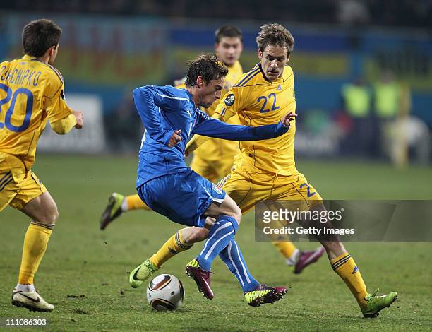 Claudio Marchisio of Italy and Marko Devic of Ukraine compete for the ball during the international friendly match between Ukraine and Italy at...