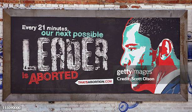 Controversial pro-life billboard depicting President Barack Obama hangs on a wall outside of a car wash March 29, 2011 in Chicago, Illinois. Thirty...