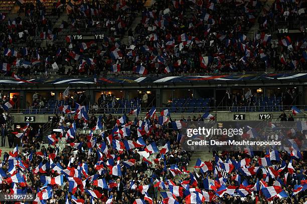 France fans wave flags during the International friendly match between France and Croatia at Stade de France at Stade de France on March 29, 2011 in...