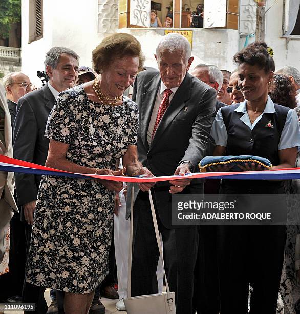 French Napoleon princess Alix de Foresta cuts the ribbon during the reopening of Napoleon Museum in Havana on March 29 alongside Cuban Vice-President...