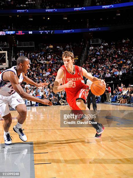 Goran Dragic of the Houston Rockets drives against Ben Uzoh of the New Jersey Nets on March 29, 2011 at the Prudential Center in Newark, New Jersey....