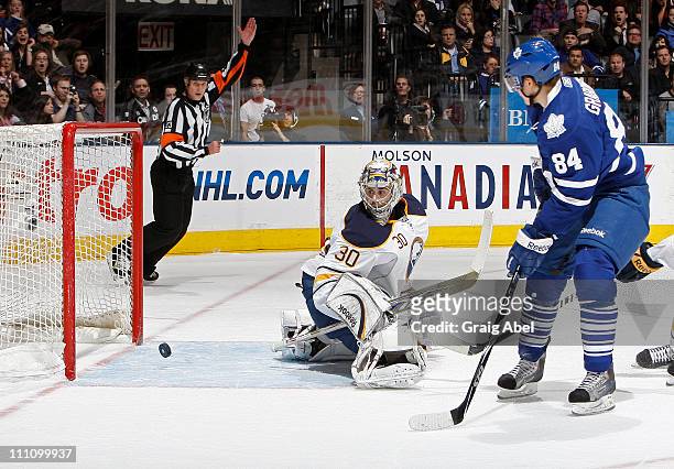 Mikhail Grabovski of the Toronto Maple Leafs scores a second-period goal against Ryan Miller of the Buffalo Sabres March 29, 2011 at the Air Canada...