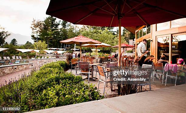 people ordering food at a poolside restaurant - stowe vermont stock pictures, royalty-free photos & images