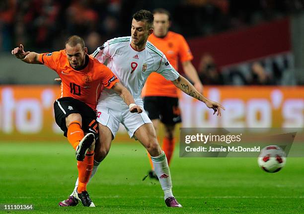 Wesley Sneijder of the Netherlands battles with Tamas Priskin of Hungary during the Group E, EURO 2012 Qualifier between Netherlands and Hungary at...