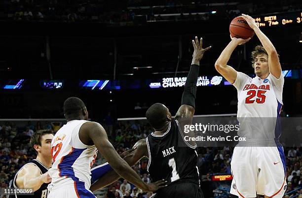 Chandler Parsons of the Florida Gators shoots over Shelvin Mack of the Butler Bulldogs during the Southeast regional final of the 2011 NCAA men's...