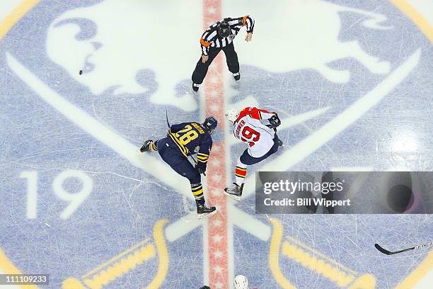 Paul Gaustad of the Buffalo Sabres takes a center ice faceoff against Marty Reasoner of the Florida Panthers at HSBC Arena on March 25, 2011 in...