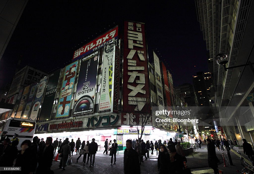 Images Of Darkened Tokyo Under Electricity Saving Measures