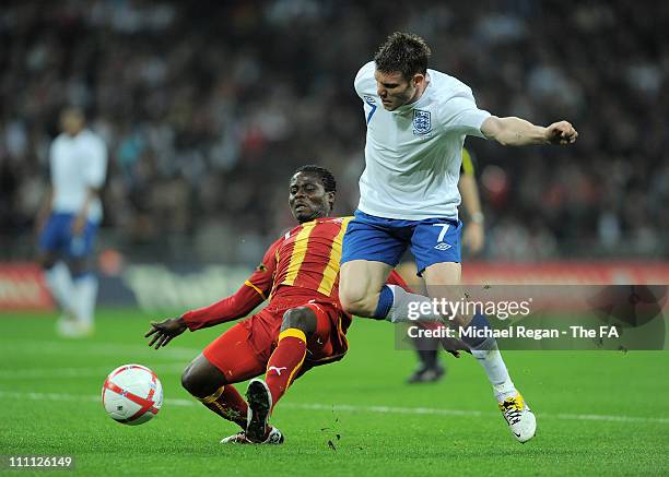 Anthony Annan of Ghana battles for the ball with James Milner of England during the international friendly match between England and Ghana at Wembley...
