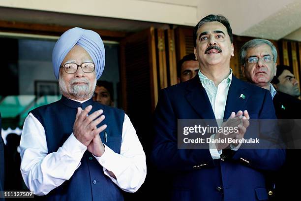 Prime Minister Syed Yusuf Raza Gilani of Pakistan and Prime Minister Manmohan Singh of India applaud the players prior to the start of the 2011 ICC...