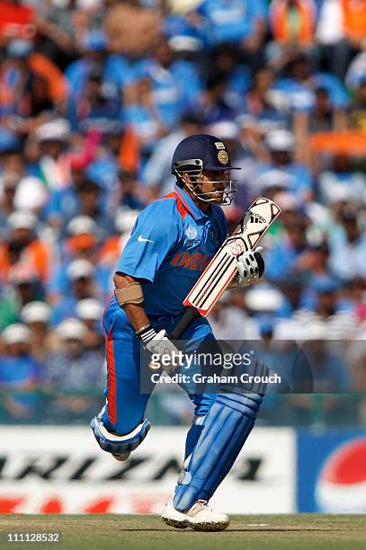 Sachin Tendulkar of India in action during the 2011 ICC World Cup second Semi-Final between Pakistan and India at Punjab Cricket Association Stadium...