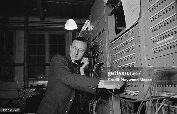 Radio technician at work in an improvised control room at the old Westminster Hospital, during the wedding of Princess Elizabeth and Philip...