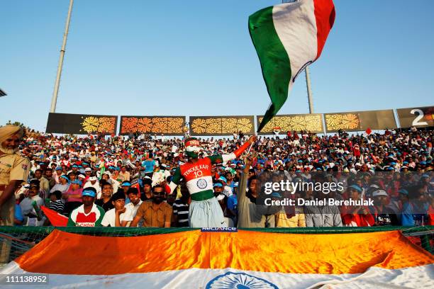 Spectators enjoy the atmosphere during the 2011 ICC World Cup second Semi-Final between India and Pakistan at Punjab Cricket Association Stadium on...