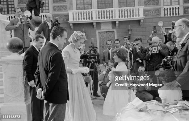 White dove is presented to American actress Grace Kelly and Prince Rainier III of Monaco , as a gift from the people of Monaco after their civil...