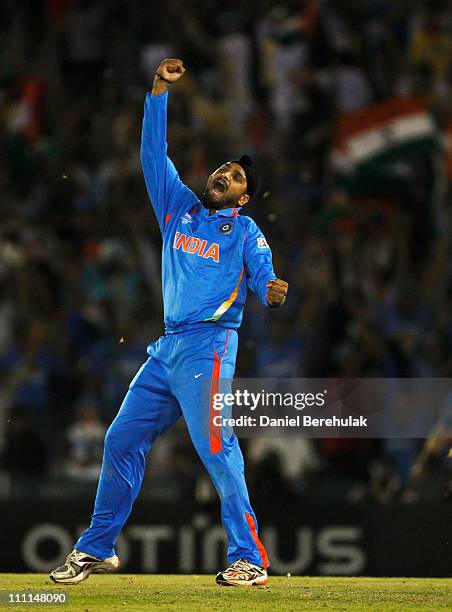 Harbhajan Singh of India celebrates after taking the wicket of Shahid Afridi of Pakistan during the 2011 ICC World Cup second Semi-Final between...