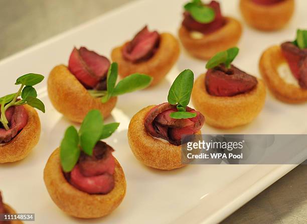 Platter of Mini Yorkshire Puddings with Roast Beef and Horse Radish Cream canapes, food akin to that which is usually served at royal receptions on...