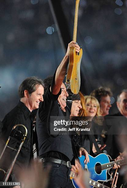 Musician Bruce Springsteen with Garry W. Tallent, Steven Van Zandt and Soozie Tyrell of the E Street Band perform at the Bridgestone halftime show...