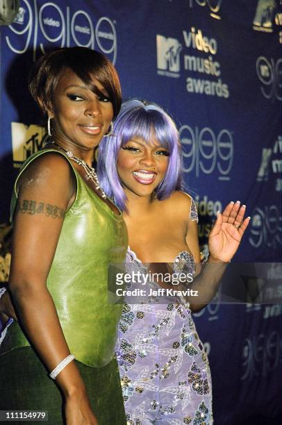 Mary J. Blige and Lil' Kim during 1999 MTV VMA's Press Room at Lincoln Center in New York City, New York, United States.
