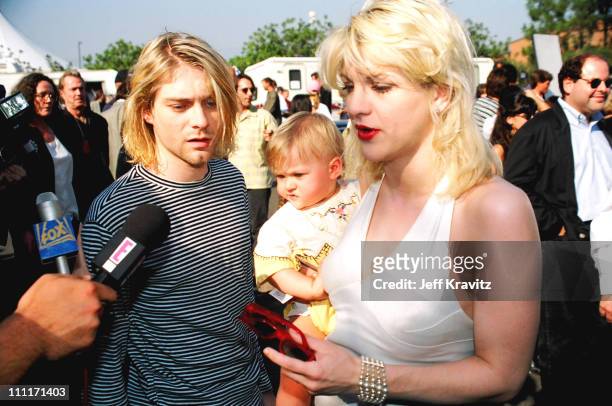 Kurt Cobain of Nirvana with wife Courtney Love and daughter Frances Bean Cobain