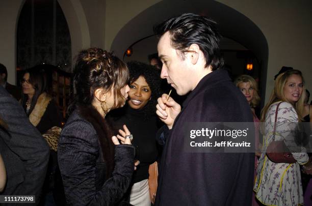 Gina Gershon and John Cusack during 2005 HBO Pre-Golden Globe Awards Party in Los Angeles, California, United States.