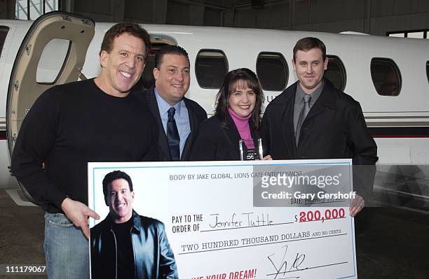 Jake Steinfeld, Kenny Dichter, CEO and Founder of Marquis Jet, Jennifer Tuttle and husband Ray Tuttle.