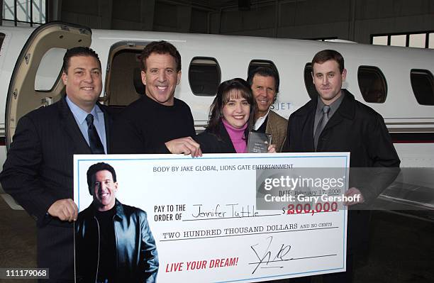 Jake Steinfeld, Kenny Dichter, CEO and Founder of Marquis Jet, Jennifer Tuttle and husband Ray Tuttle.