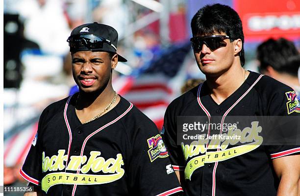 Ken Griffey Jr. & Jose Canseco during MTV's 3rd Annual Rock 'n Jock Softball at Memorial Park in Long Beach, California, United States.
