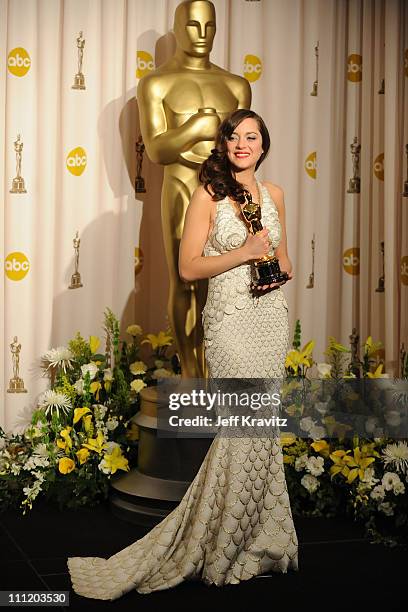 Actress Marion Cotillard poses in the press room during the 80th Annual Academy Awards at the Kodak Theatre on February 24, 2008 in Los Angeles,...