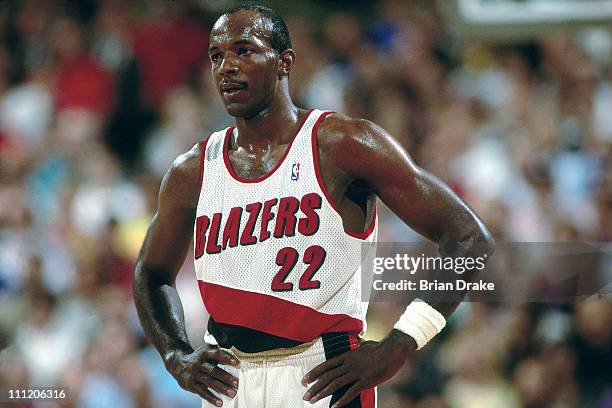 Clyde Drexler of the Portland Trailblazers looks on during a game at the Veterans Memorial Coliseum in 1992 in Portland, Oregon. NOTE TO USER: User...